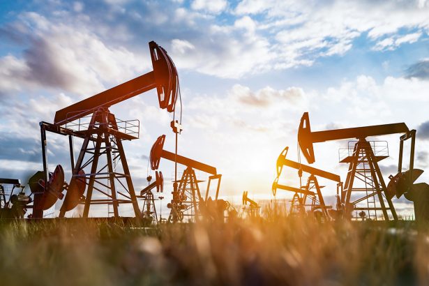 Oil pump jack work on oilfield petroleum extraction