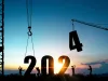 Silhouette of construction workers with crane