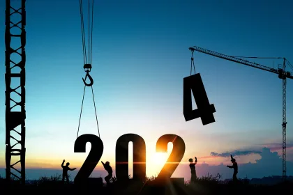 Silhouette of construction workers with crane