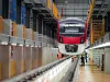 Railway Worker Goes Along the Train with a Check
