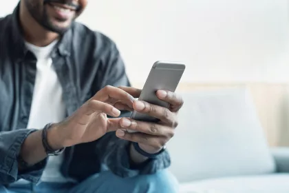 Young man using mobile phone.