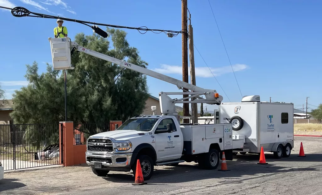 TrueNet Construction crew working on aerial fiber construction.